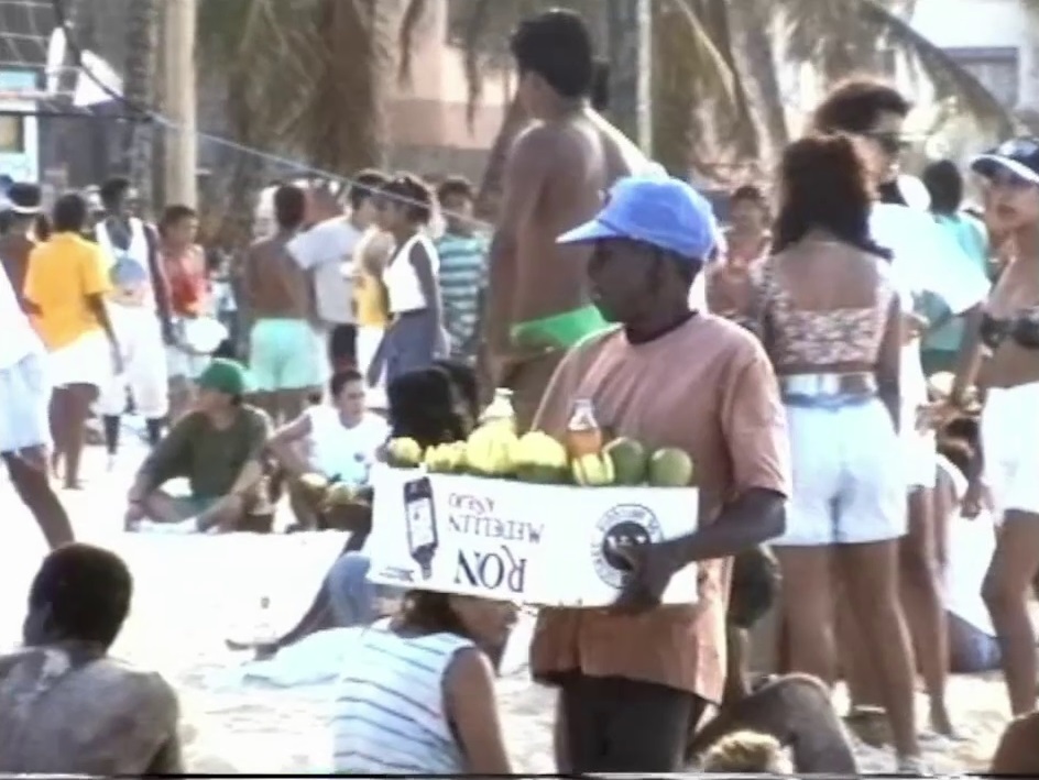 A typical beach scene in North End in San Andrés with sellers hawking their wares to the tourists.
